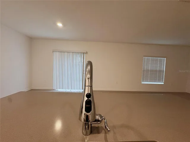 a room with gym equipment and a large window