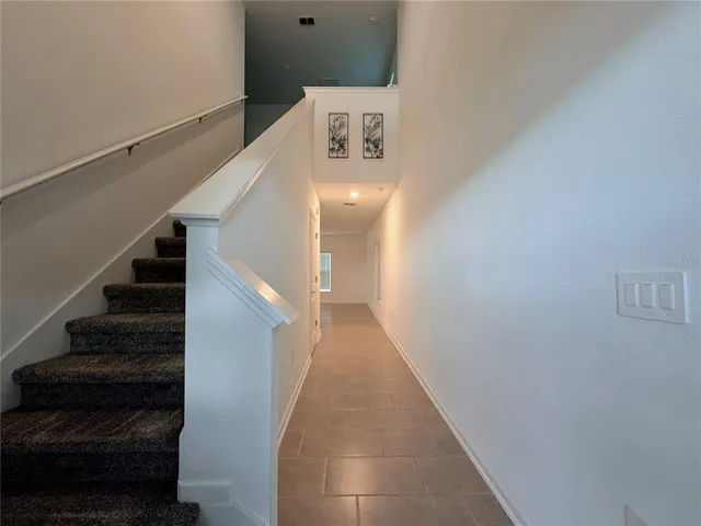 a view of a hallway with staircase