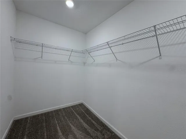 a view of a room with racks on the wall