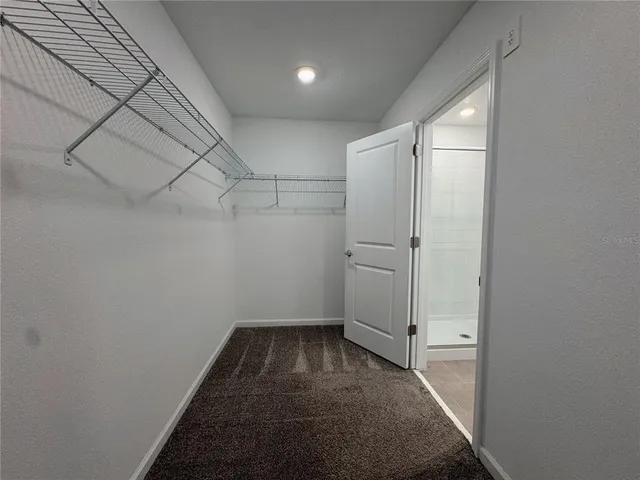 an empty room with staircase