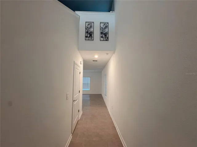 a view of a hallway with closet