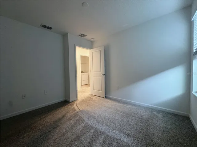 a view of a hallway with a white walls