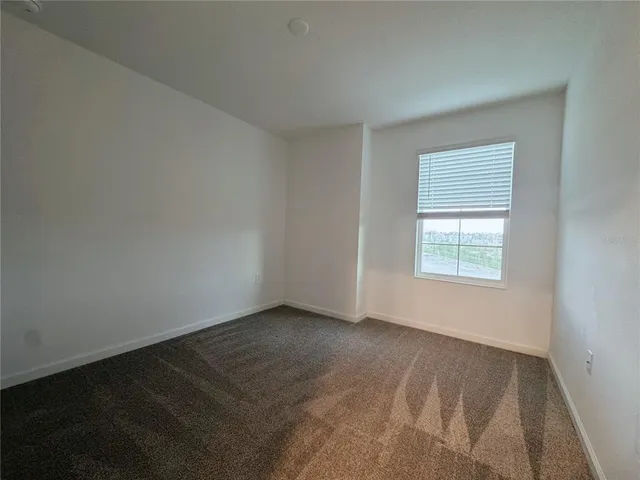an empty room with closet area