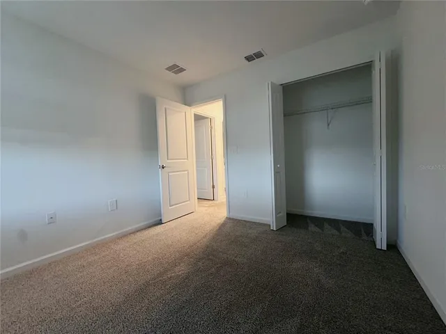 a view of a house with a back yard