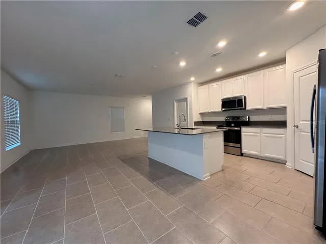 a large kitchen with cabinets