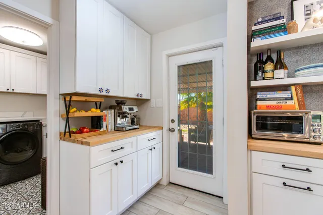 a kitchen with stainless steel appliances a stove microwave and cabinets