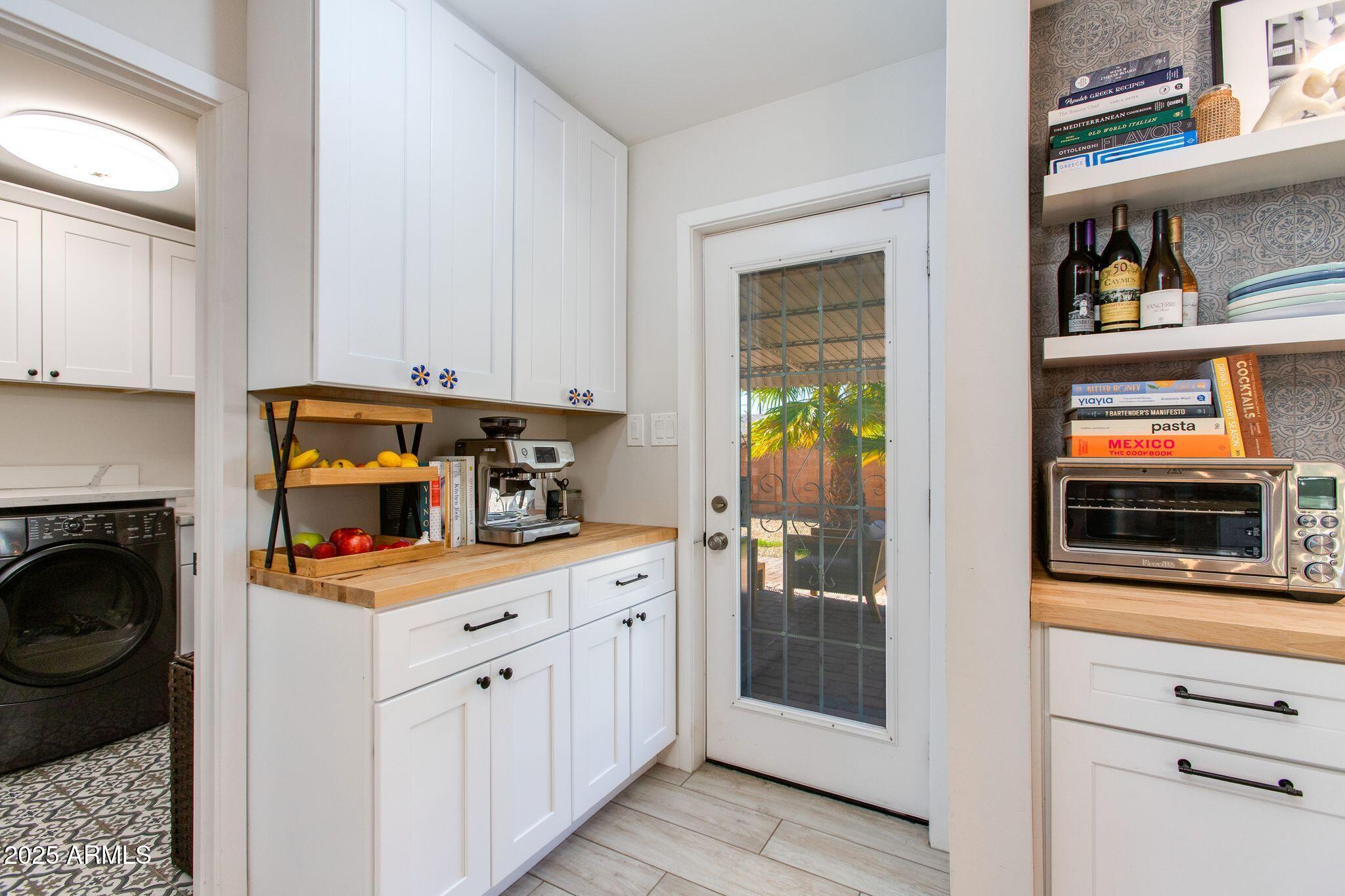 913 West Missouri Avenue Phoenix, AZ 85013 - Photo 19 of 38 a kitchen with stainless steel appliances a stove microwave and cabinets