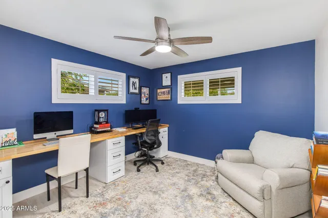a workspace with furniture and a window