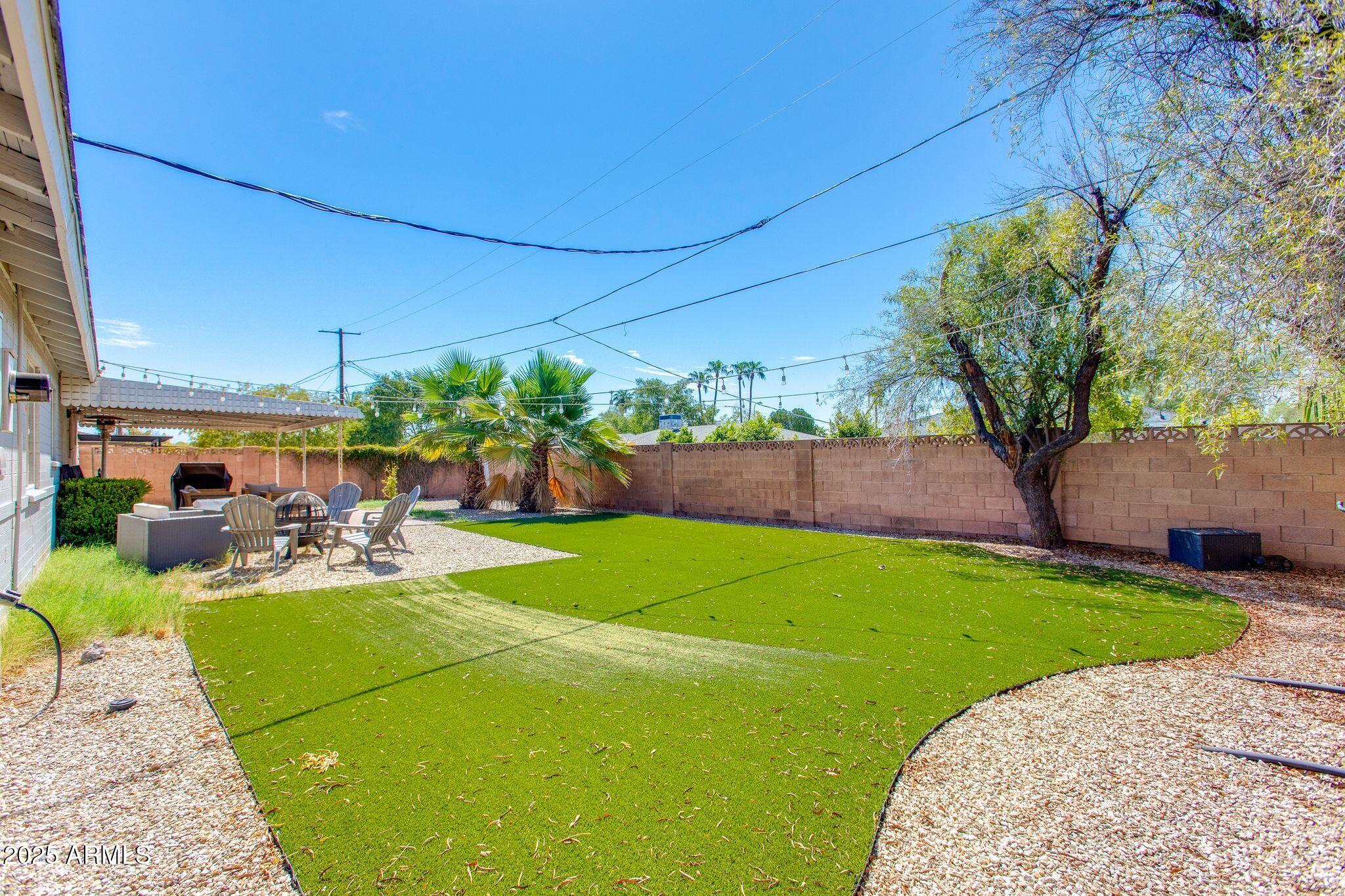 913 West Missouri Avenue Phoenix, AZ 85013 - Photo 34 of 38 a view of a backyard with plants and a patio