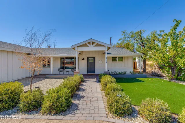 a front view of a house with garden