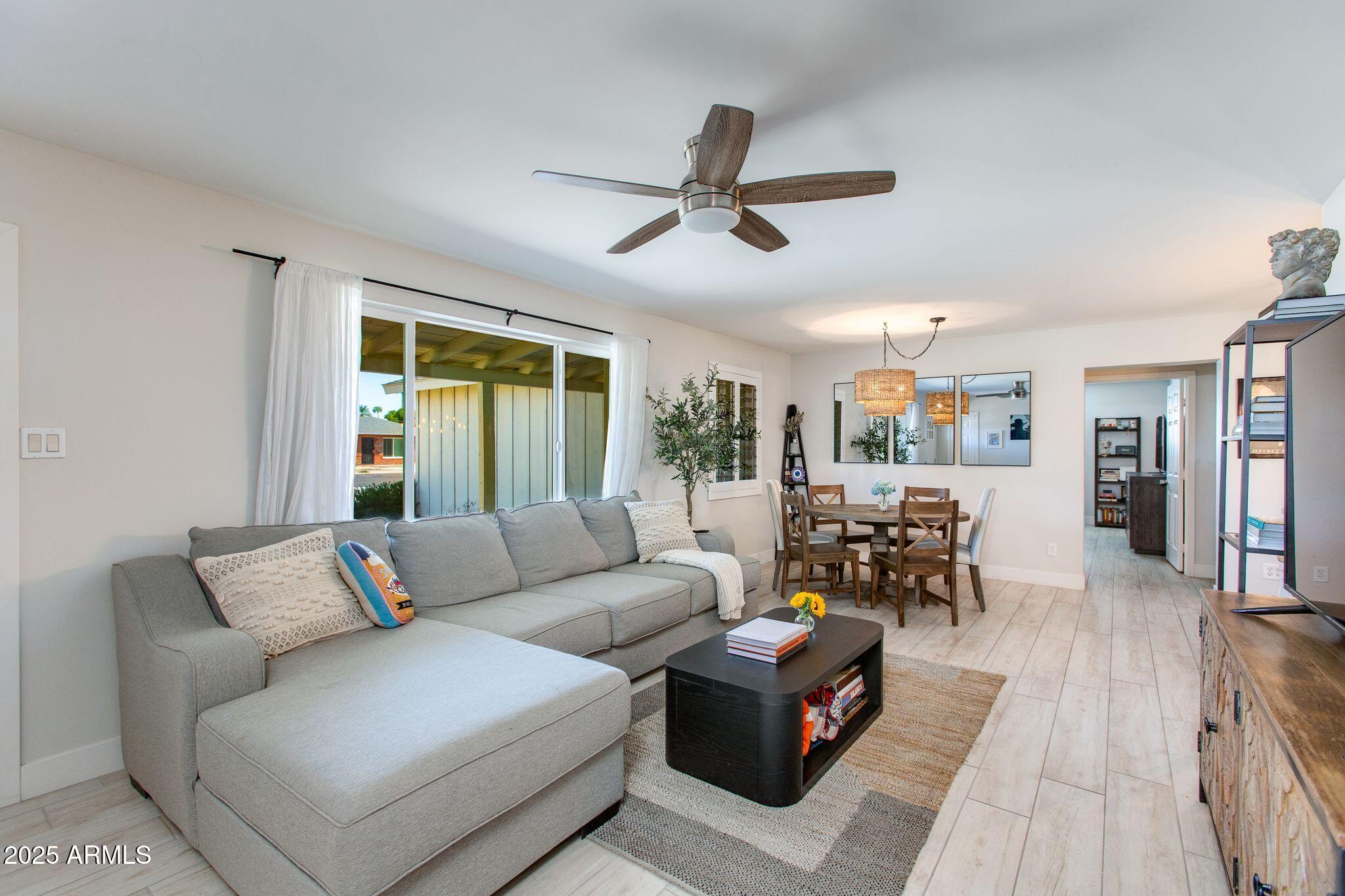913 West Missouri Avenue Phoenix, AZ 85013 - Photo 10 of 38 a living room with furniture and a large window