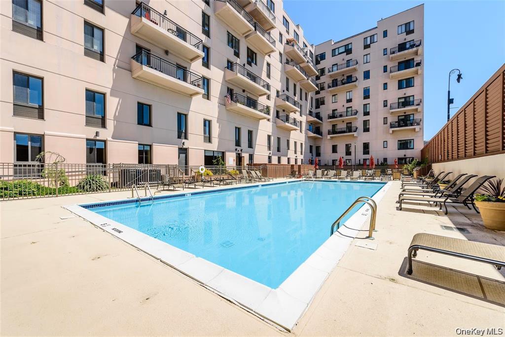 100 West Broadway, Unit 3D Long Beach, NY 11561 - Photo 27 of 50 a view of a swimming pool with outdoor seating
