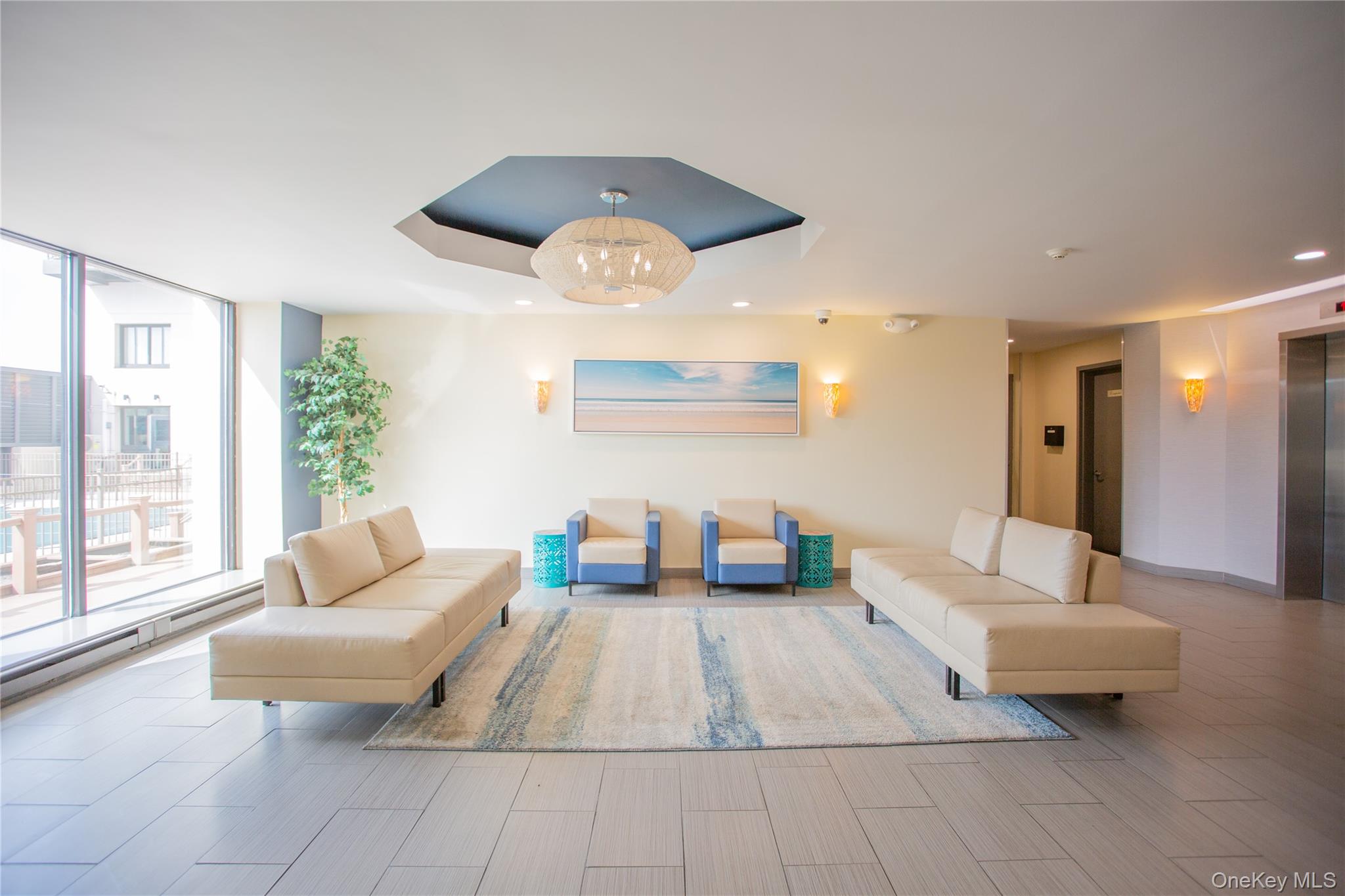 100 West Broadway, Unit 3D Long Beach, NY 11561 - Photo 31 of 50 a living room with furniture and a large window