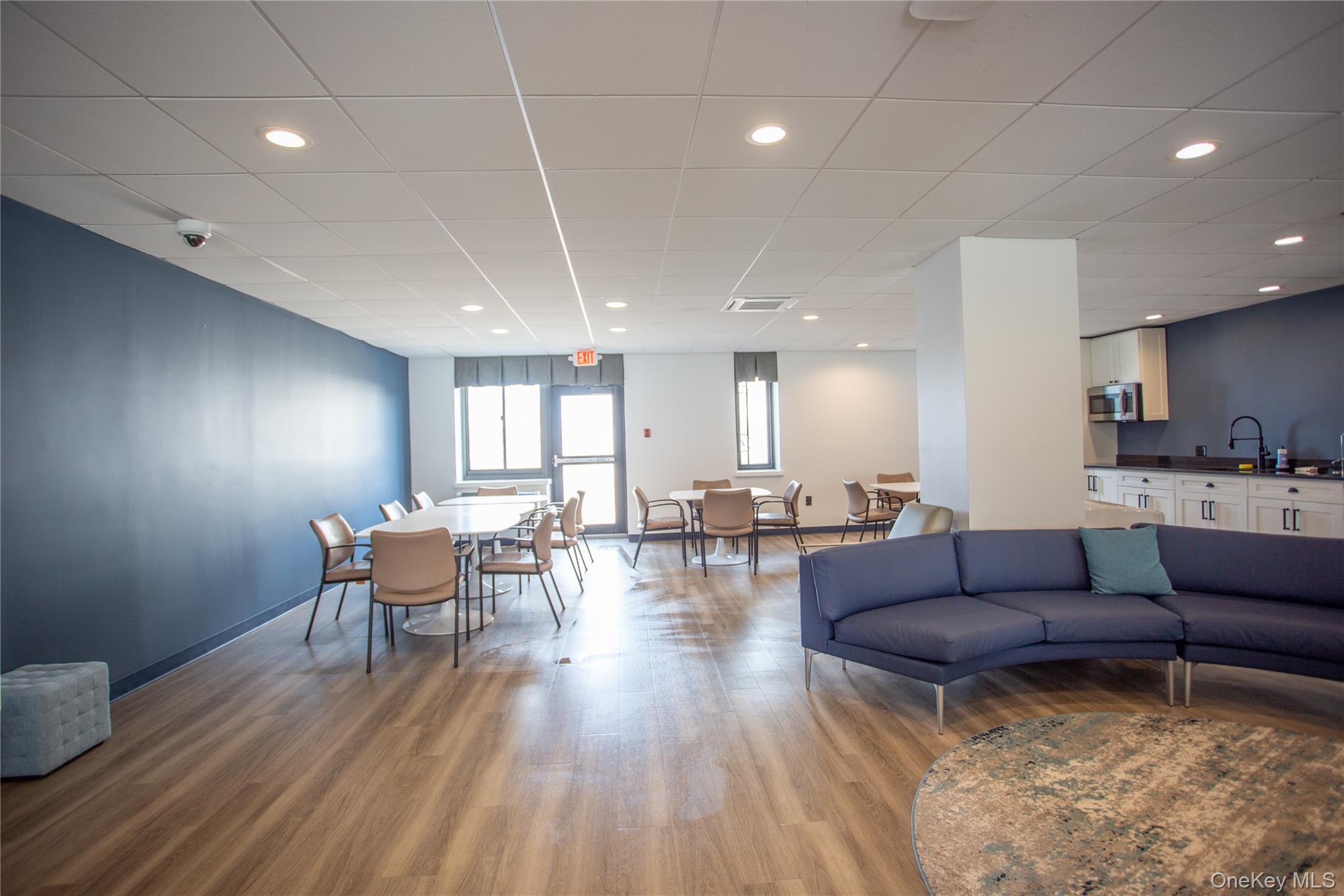 100 West Broadway, Unit 3D Long Beach, NY 11561 - Photo 38 of 50 a living room with furniture and wooden floor
