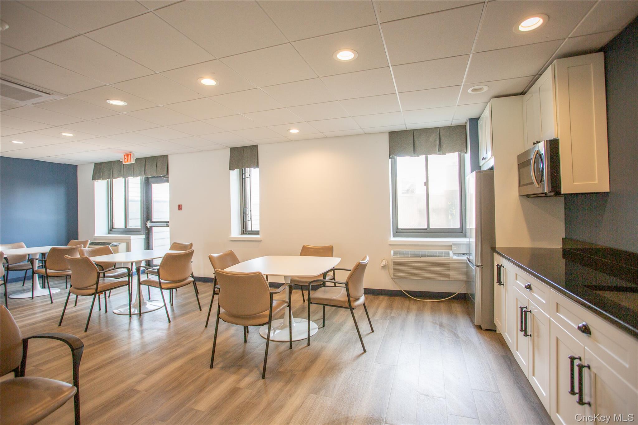 100 West Broadway, Unit 3D Long Beach, NY 11561 - Photo 40 of 50 a view of a dining room with furniture and wooden floor
