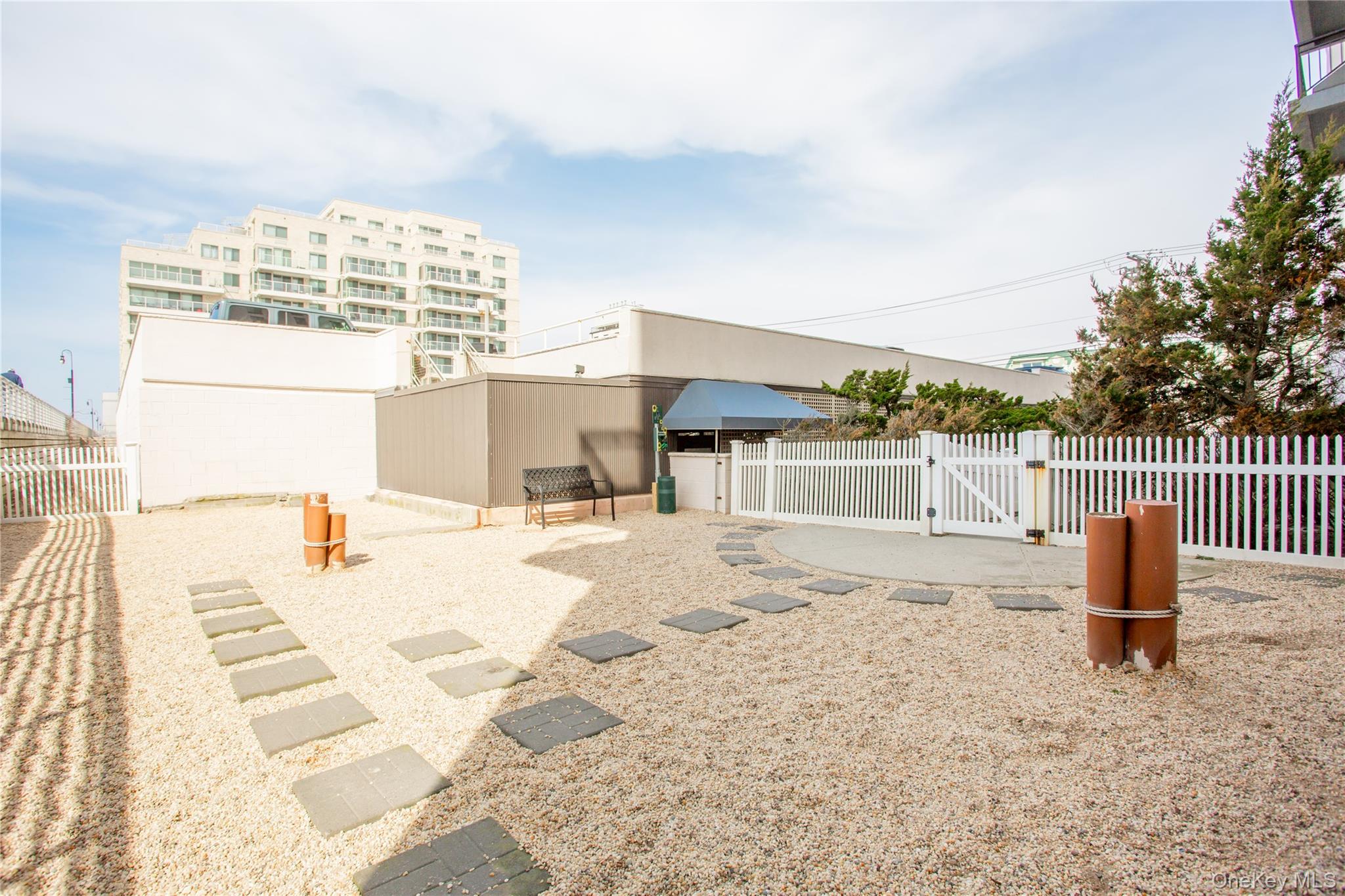 100 West Broadway, Unit 3D Long Beach, NY 11561 - Photo 41 of 50 a view of a swimming pool with a lounge chairs