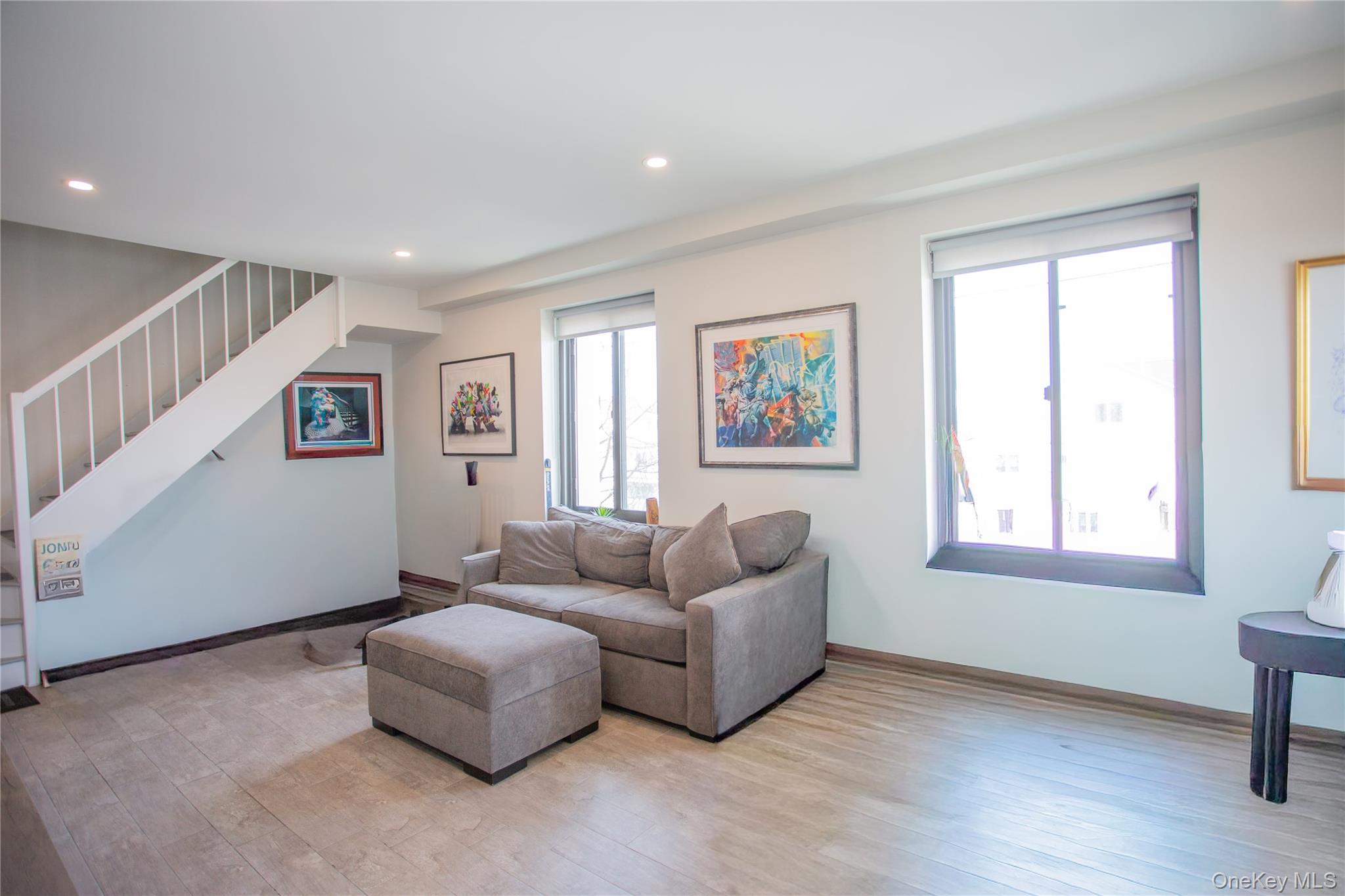 100 West Broadway, Unit 3D Long Beach, NY 11561 - Photo 5 of 50 a living room with furniture and a window