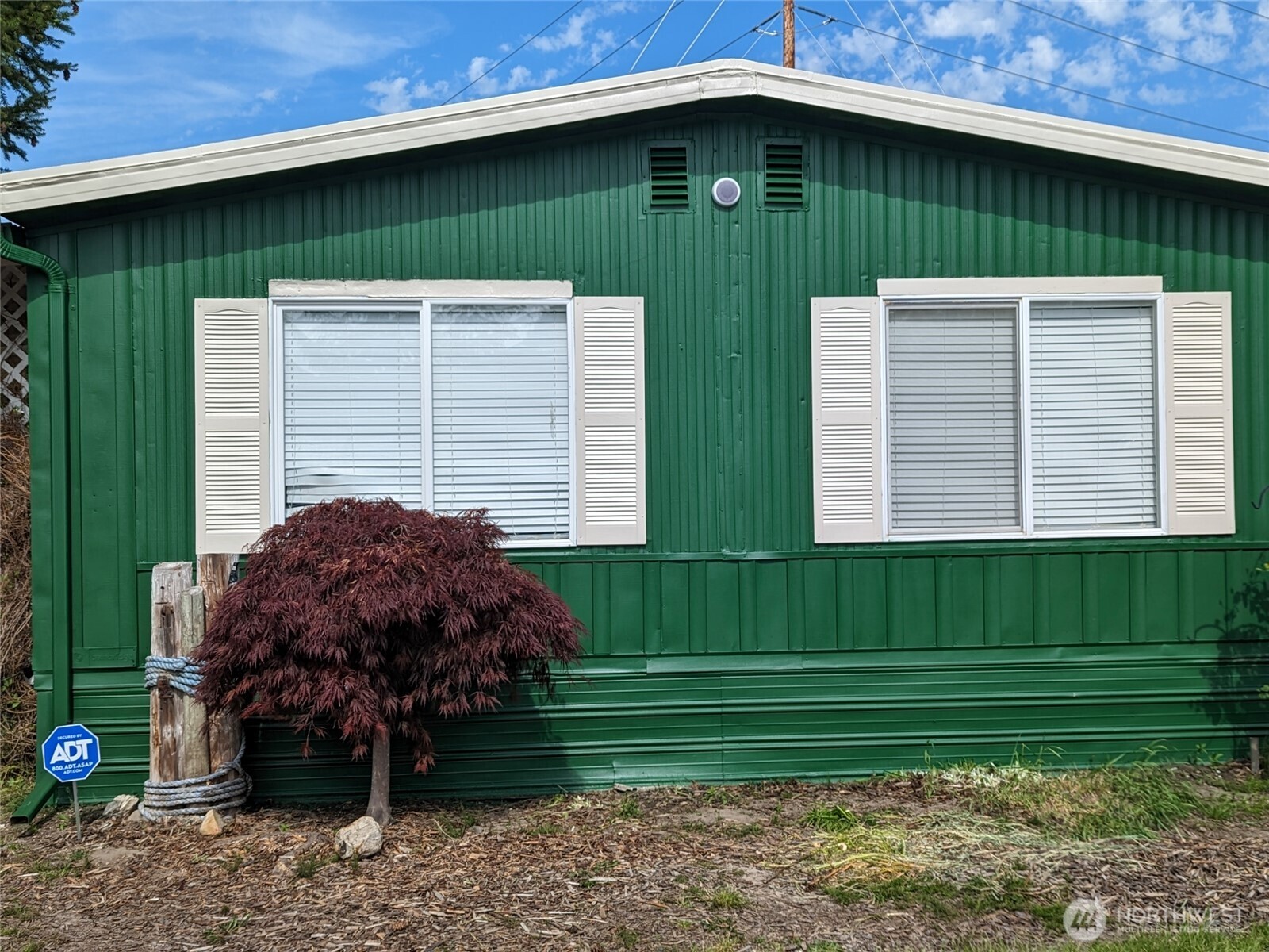 5600 Mt Solo Road, Unit 136 Longview, WA 98632 - Photo 1 of 3 a front view of a house with a garden