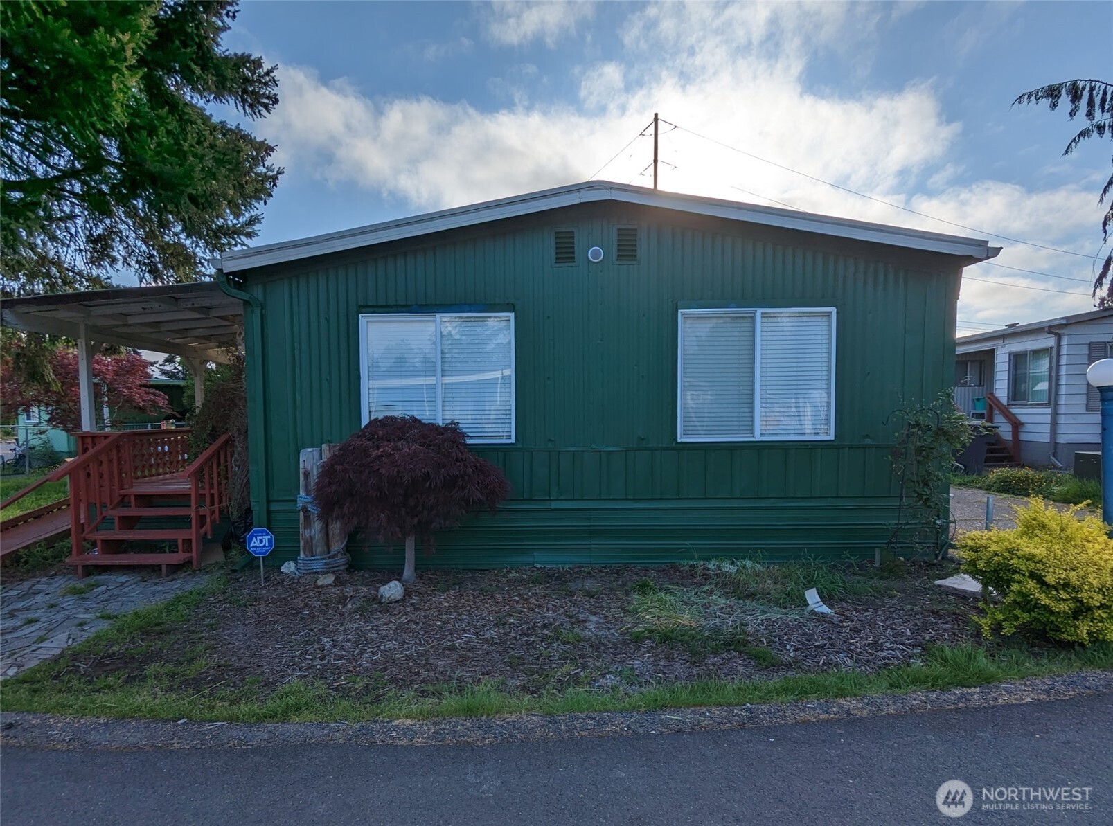 5600 Mt Solo Road, Unit 136 Longview, WA 98632 - Photo 2 of 3 a front view of a house with garden