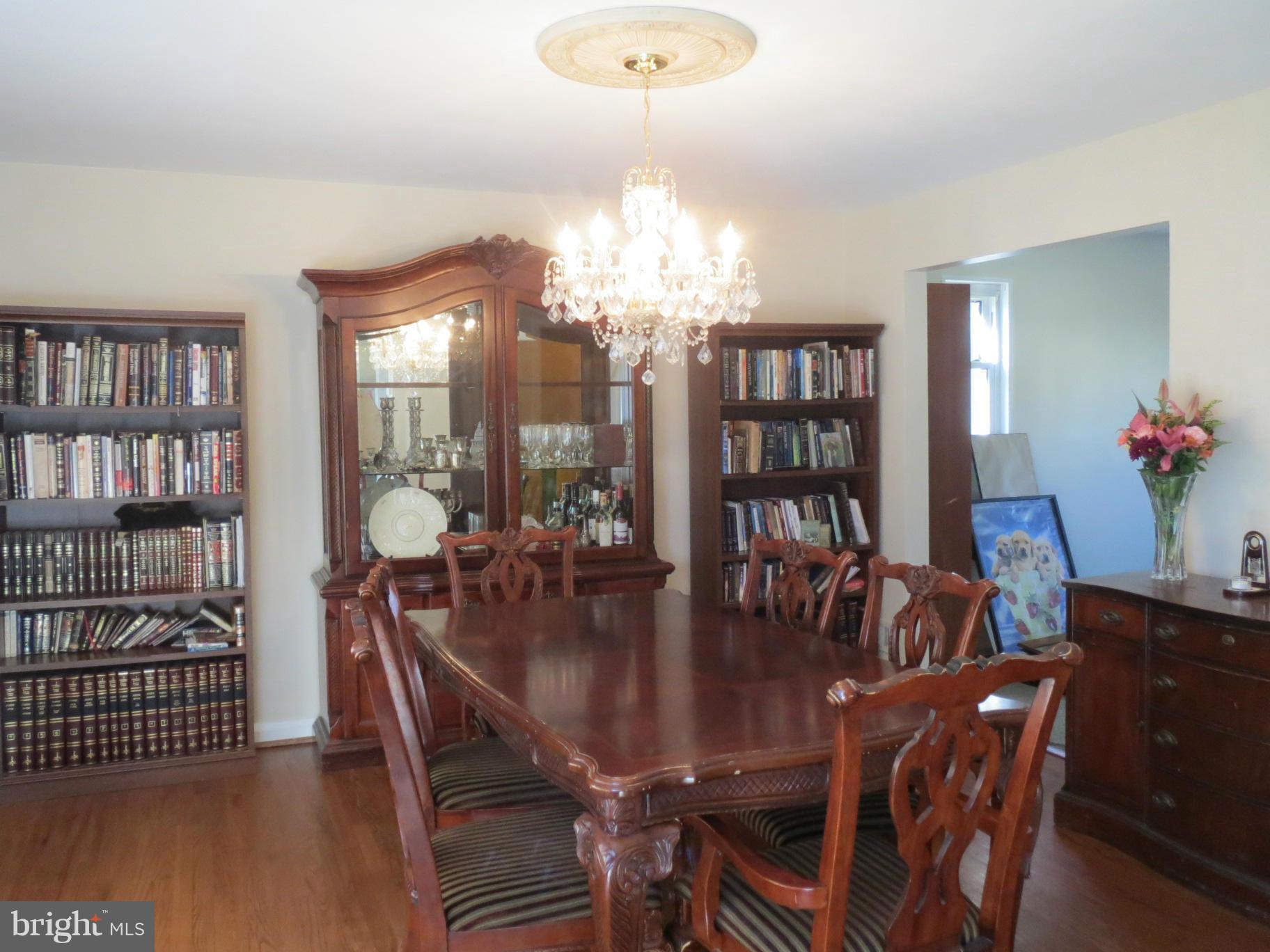 7006 Boxford Road Baltimore, MD 21215 - Photo 3 of 14 a view of a dining room with furniture and chandelier