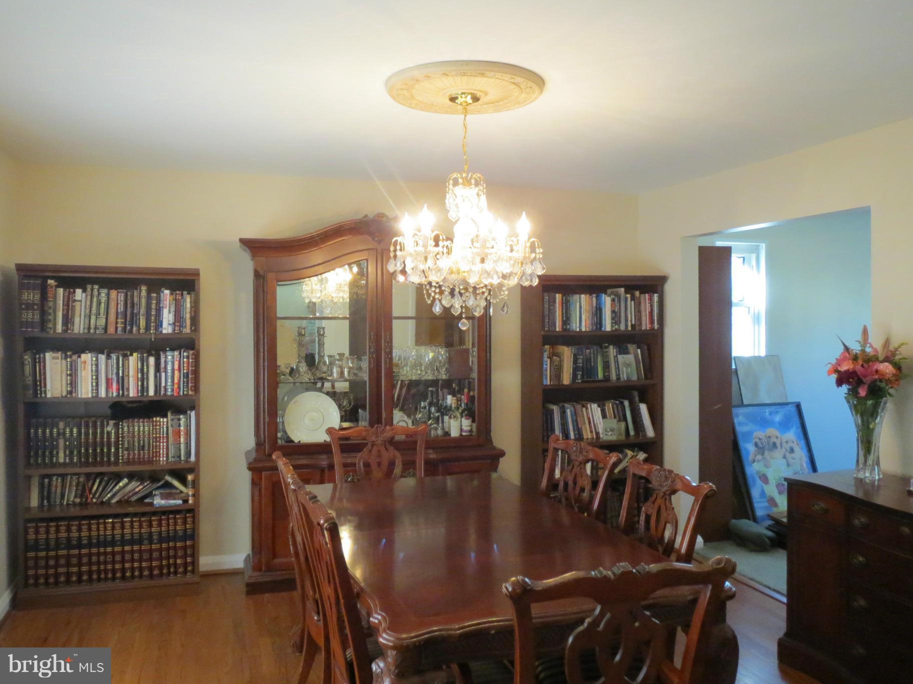 7006 Boxford Road Baltimore, MD 21215 - Photo 4 of 14 a view of a dining room with furniture and wooden floor