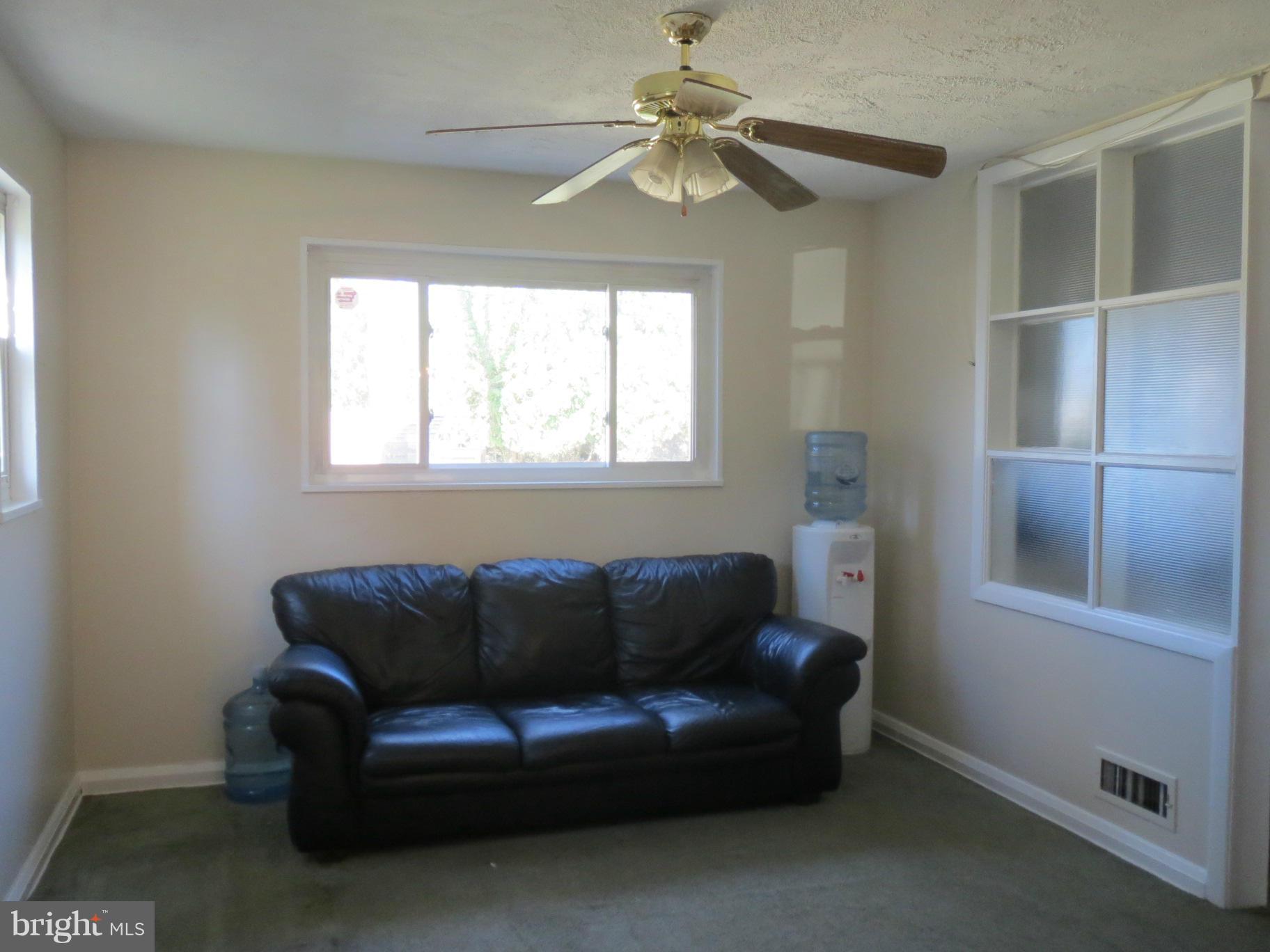 7006 Boxford Road Baltimore, MD 21215 - Photo 5 of 14 a living room with furniture and a window