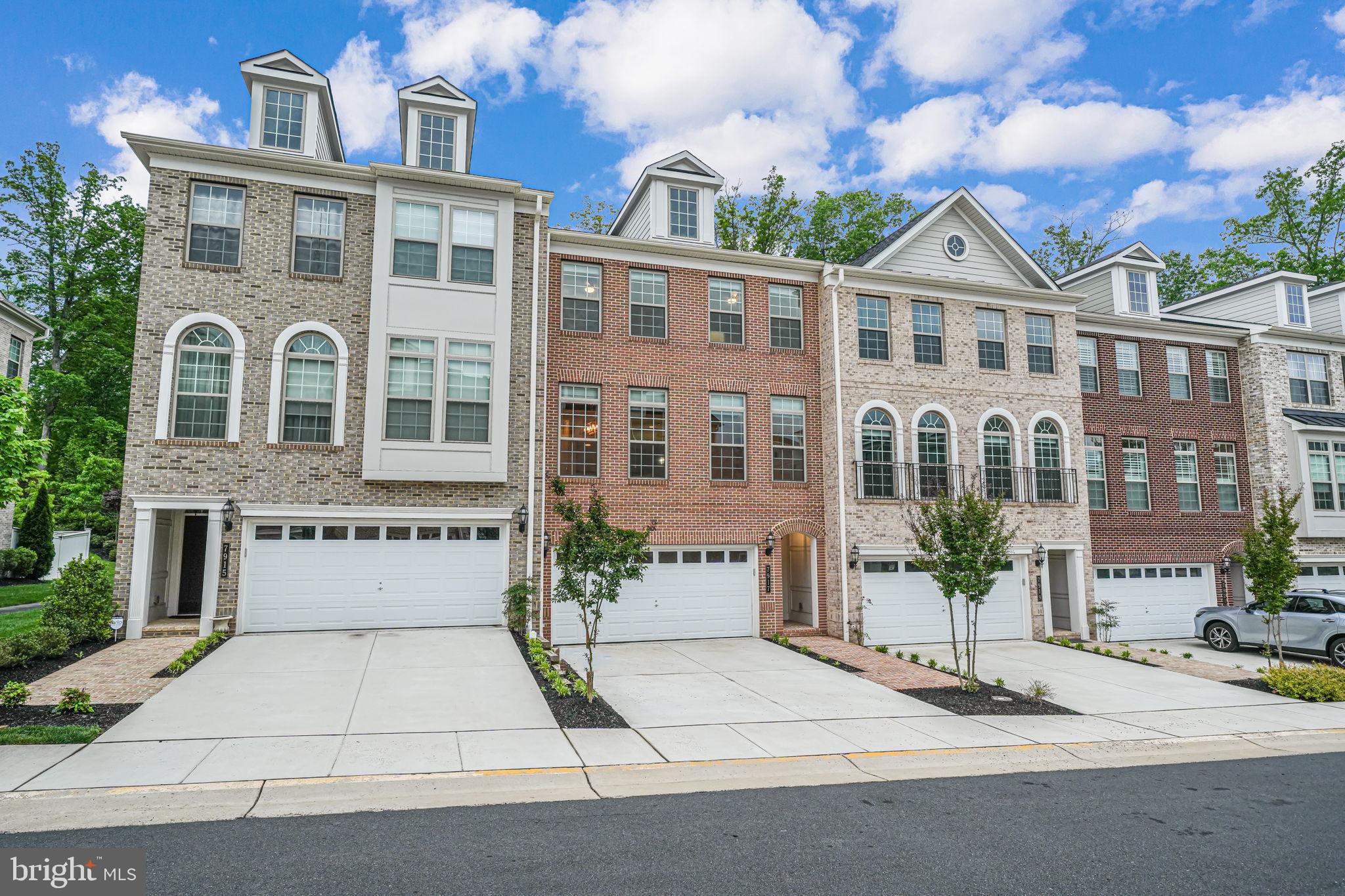 a front view of a building with a garden