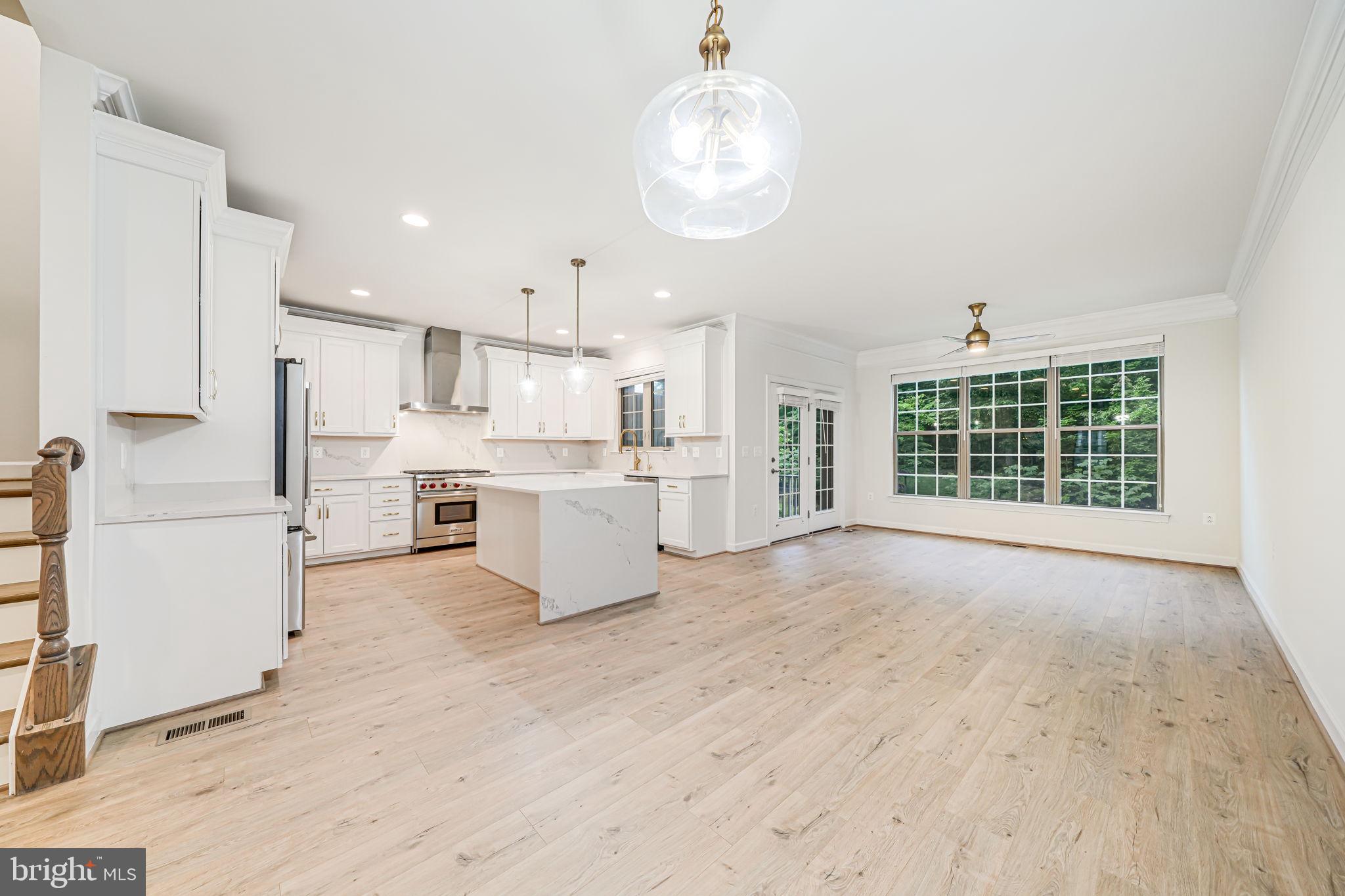 7917 Turtle Creek Circle Gainesville, VA 20155 - Photo 16 of 41 a large white kitchen with white cabinets and a dishwasher