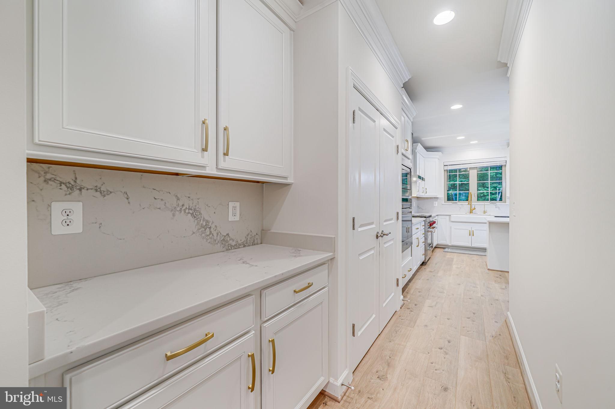 7917 Turtle Creek Circle Gainesville, VA 20155 - Photo 25 of 41 a view of a kitchen with white cabinets