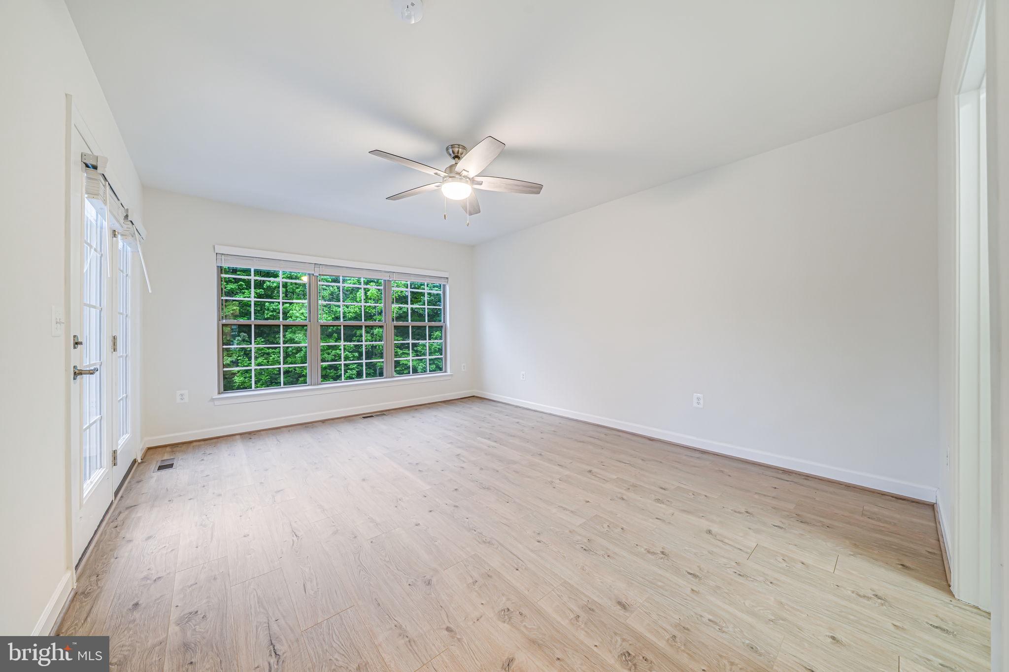 7917 Turtle Creek Circle Gainesville, VA 20155 - Photo 28 of 41 wooden floor in an empty room with a window