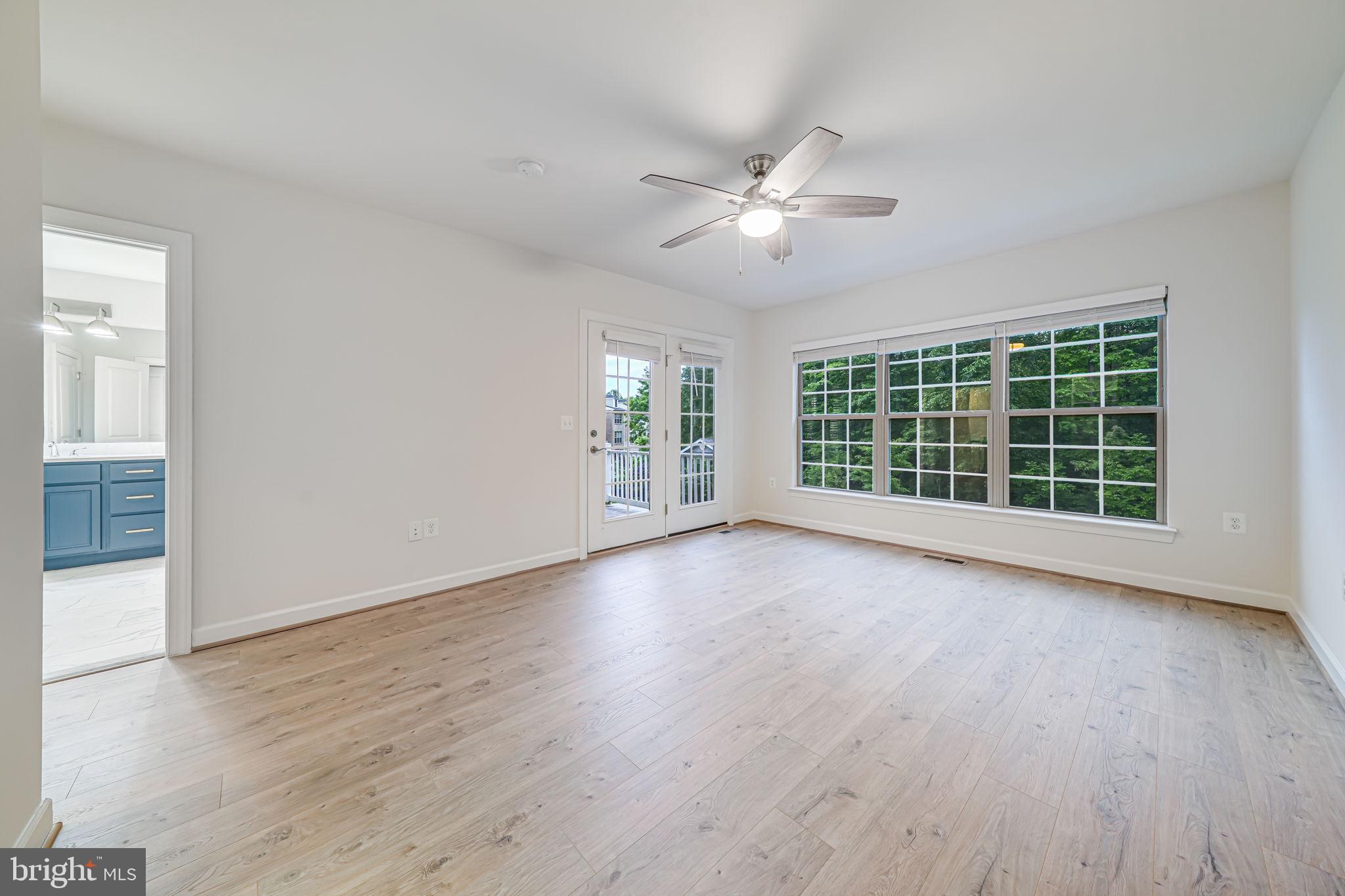7917 Turtle Creek Circle Gainesville, VA 20155 - Photo 29 of 41 a view of a room with wooden floor and windows