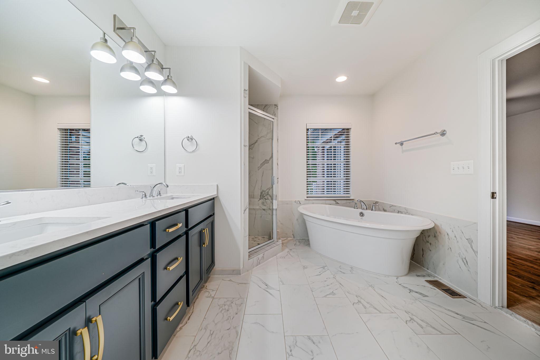 7917 Turtle Creek Circle Gainesville, VA 20155 - Photo 33 of 41 a spacious bathroom with a double vanity sink mirror and toilet