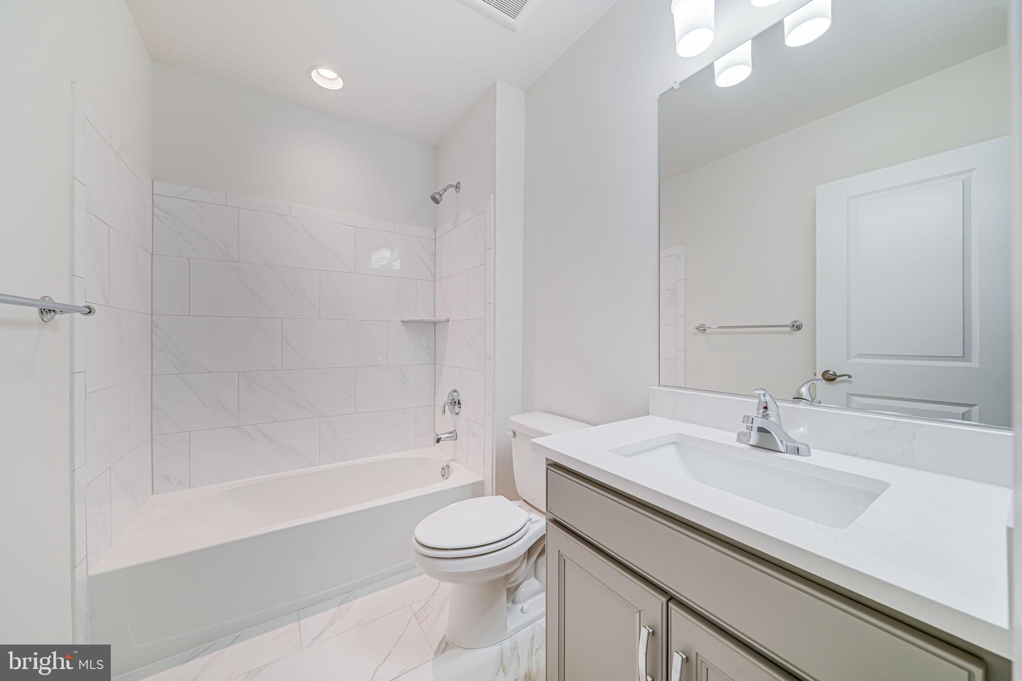 7917 Turtle Creek Circle Gainesville, VA 20155 - Photo 41 of 41 a bathroom with a sink a toilet and shower