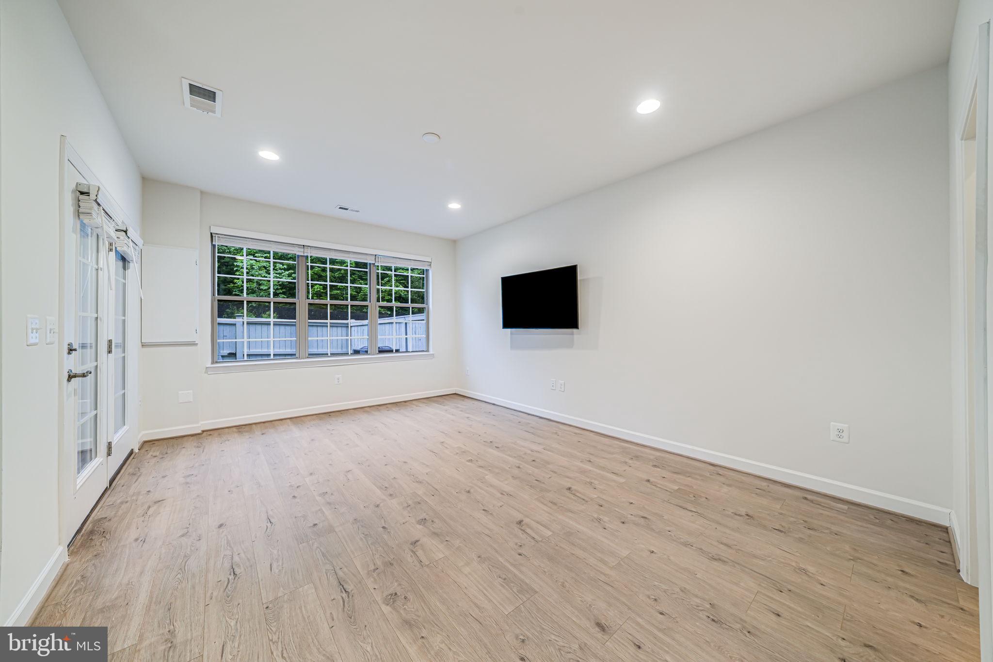 7917 Turtle Creek Circle Gainesville, VA 20155 - Photo 5 of 41 wooden floor in an empty room with a window
