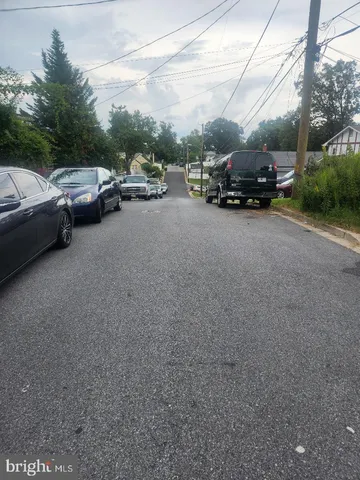 a view of street with parked cars