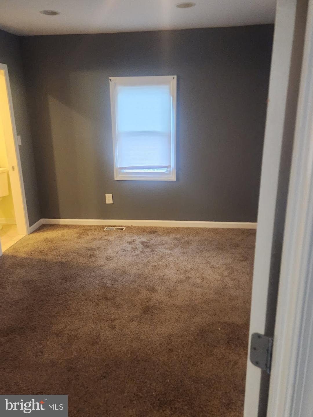 1011 Nova Avenue Capitol Heights, MD 20743 - Photo 5 of 15 a view of an empty room with a window
