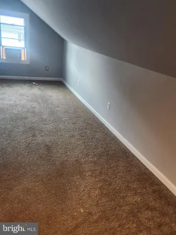 en empty room with windows