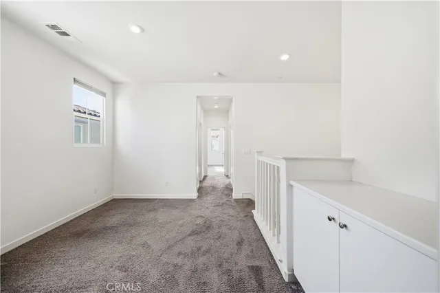 a view of hallway with livingroom