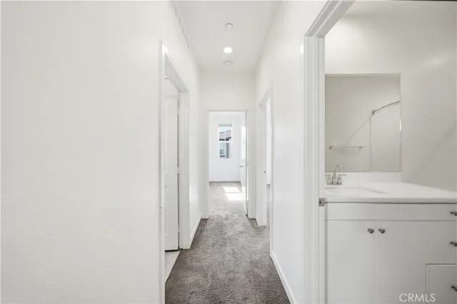 a view of a hallway with two rooms