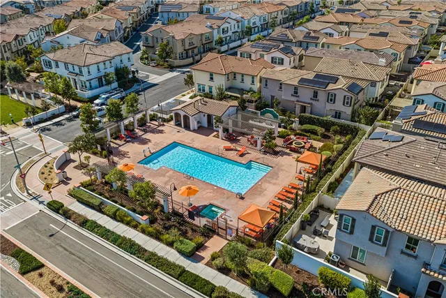 an aerial view of residential houses with outdoor space