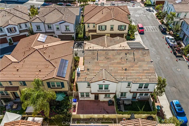 a view of multiple houses with a street