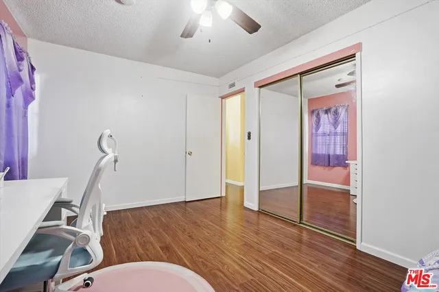 a very nice looking room with wooden floor