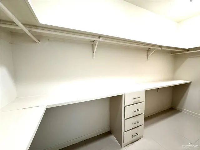 a kitchen with stainless steel appliances granite countertop a refrigerator a stove a sink and a refrigerator