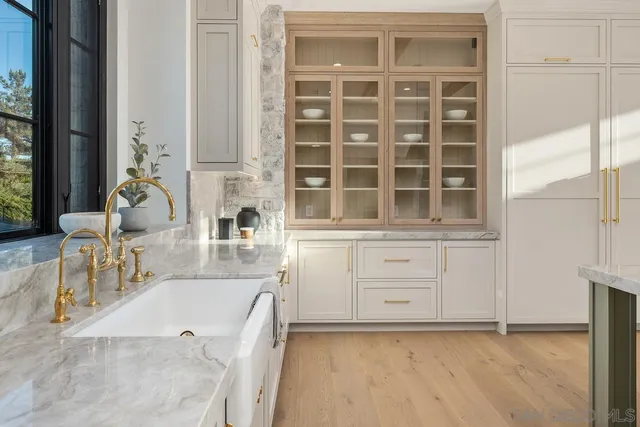 a kitchen with cabinets and a stove