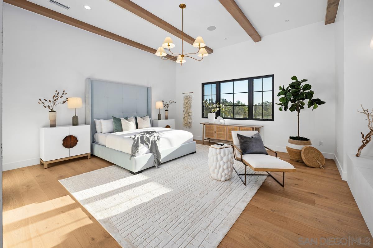 6691 Camino Saucito Rancho Santa Fe, CA 92067 - Photo 20 of 54 a bedroom with a bed couch and window