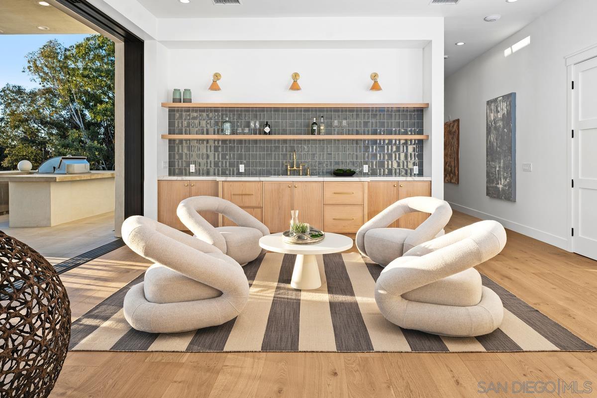 6691 Camino Saucito Rancho Santa Fe, CA 92067 - Photo 28 of 54 a living room with furniture and a large window