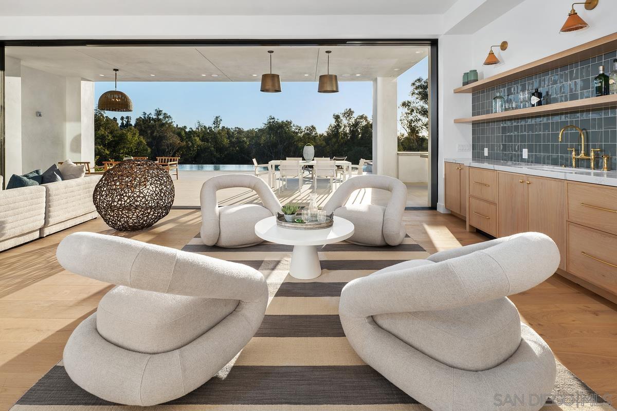 6691 Camino Saucito Rancho Santa Fe, CA 92067 - Photo 32 of 54 a living room with furniture and a large window