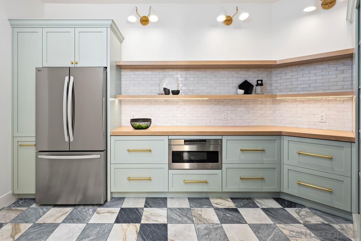 6691 Camino Saucito Rancho Santa Fe, CA 92067 - Photo 35 of 55 a kitchen with a refrigerator and a sink