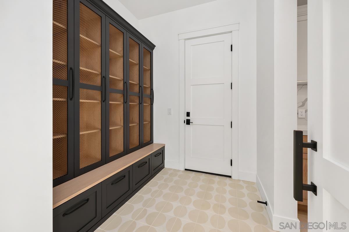 6691 Camino Saucito Rancho Santa Fe, CA 92067 - Photo 41 of 54 a view of staircase with white walls