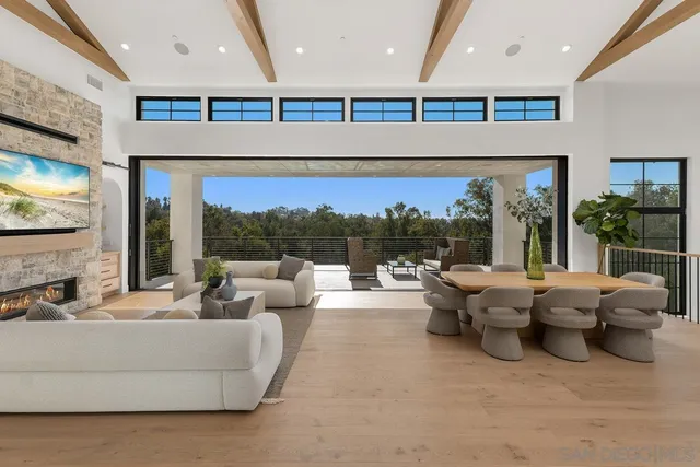 a living room with couches and a flat screen tv